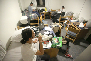 Chamberlain Zhang, Alex Thompson and Paul Weiner, all sophomores, study in their forced triple in Lyons Hall. Zhang called the situation 