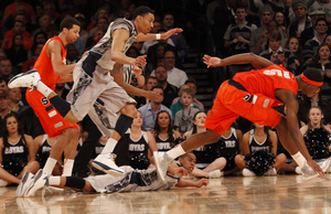 Syracuse and Georgetown concluded their epic Big East rivalry with a classic 58-55 overtime thriller in Madison Square Garden Friday night. The Orange victory evened the all-time Big East tournament series at 7-7.