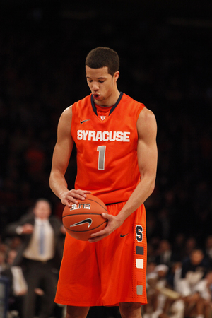 Syracuse point guard Michael Carter-Williams breathes before one of his late free throw attempts. The sophomore knocked down five of his last six attempts at the line to ice the Orange's victory over Pittsburgh.