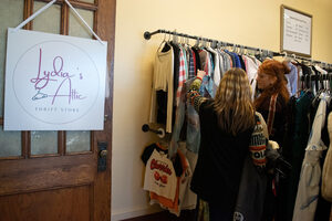 Patrons browse through clothes at Lydia’s Attic, a thrift shop on the third floor of University United Methodist Church. The shop sells garments for going out and displays current trends and styles.