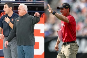 Since becoming Syracuse’s head coach before the 2022 season, Gary Gait (left) is 0-3 against Maryland head coach John Tillman (right).