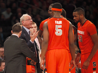 Head coach Jim Boeheim talks to his team during a timeout during overtime.