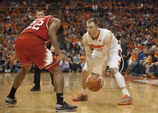 Trevor Cooney stares down N.C. State's Ralston Turner on the perimeter. The two sharpshooters traded 3s throughout the game, Turner heating up in the second half. 