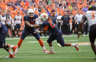 Terrel Hunt moves to hand the ball of to Prince-Tyson Gulley. The duo combined for 295 yards in the Orange's 34-20 loss to Maryland in the Carrier Dome Sunday.