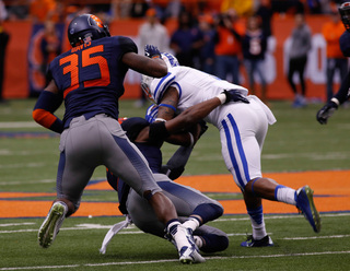 Senior outside linebacker Dyshawn Davis, playing his last home game, prepares to assist on a tackle. 