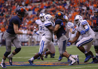 Gulley gets stopped by a defender after taking a handoff from Kimble. 