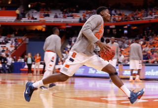 Walk-on Doyin Akintobe-Adeyeye prepares to rise up for a dunk during warm-ups before Friday's game against Kennesaw State.