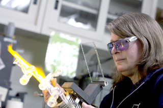 Glassblower Sally Prasch has worked at Syracuse University for 10 years as its glass shop director and facility manager. Prasch, who is 56 years old, has been glassblowing since she was 13.