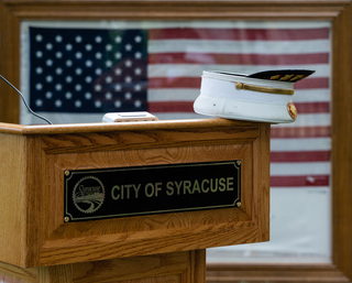 A police officer's cap is seen placed on the podium during a memorial service in remembrance of the victims of the 9/11 attacks on Sunday, Sept. 11, 2022. 